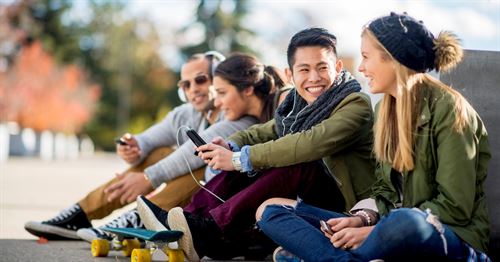 group of students sitting outside